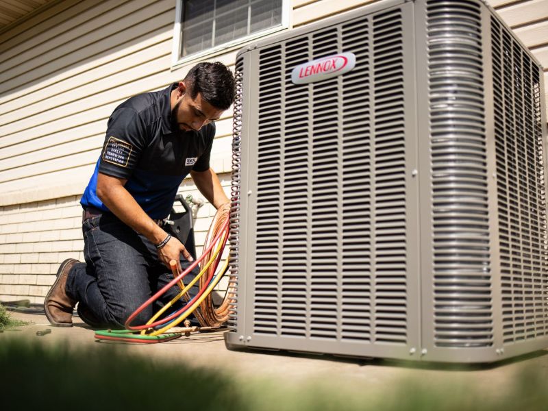 HVAC technician completing Air Conditioning Replacement in Tulsa, OK